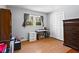 Spare bedroom featuring hardwood floors, a closet, and a large window at 363 Arnold Mill Rd, Woodstock, GA 30188