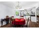 Cozy dining area with hardwood floors, chandelier, and table set for four at 363 Arnold Mill Rd, Woodstock, GA 30188