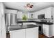 Modern kitchen featuring stainless steel appliances, white cabinets, and a functional island at 363 Arnold Mill Rd, Woodstock, GA 30188