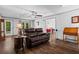 Bright living room with hardwood floors, neutral walls, and a view into the dining area at 363 Arnold Mill Rd, Woodstock, GA 30188