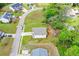 An aerial view of a two-story home with a driveway and green lawn surrounded by trees at 74 Macland Mill Ln, Dallas, GA 30157