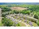 An aerial shot showcases a residential neighborhood with green spaces and charming homes at 74 Macland Mill Ln, Dallas, GA 30157