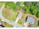 An aerial view of a two-story home with a driveway and green lawn at 74 Macland Mill Ln, Dallas, GA 30157