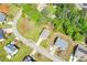 An aerial view of a two-story home with a driveway and green lawn in a residential neighborhood at 74 Macland Mill Ln, Dallas, GA 30157