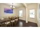 Dining room with dark wood floors, chandelier, and a formal dining table with seating for six at 74 Macland Mill Ln, Dallas, GA 30157