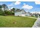 Two-story home on a large lot with a grassy front yard and long driveway at 74 Macland Mill Ln, Dallas, GA 30157