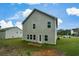 A beautiful view of a house with green grass, white siding and a small patio at 74 Macland Mill Ln, Dallas, GA 30157