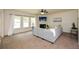 Bright living room with large windows, fireplace, and comfortable sectional sofa at 74 Macland Mill Ln, Dallas, GA 30157