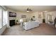 Cozy living room featuring a fireplace, large windows, and plush carpet at 74 Macland Mill Ln, Dallas, GA 30157