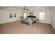 Spacious main bedroom with tray ceiling, ceiling fan, and natural light at 74 Macland Mill Ln, Dallas, GA 30157