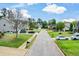Street view of homes with manicured lawns and various vehicles at 74 Macland Mill Ln, Dallas, GA 30157