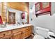 Charming bathroom with wood accents, double vanity, and rustic decor at 800 Knox Ln, Canton, GA 30114