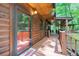 Charming log cabin entrance with a covered porch and 