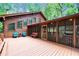 Beautiful log home featuring a large deck, screened porch, and wooded views at 800 Knox Ln, Canton, GA 30114