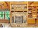 Close-up of the stone fireplace with decorative accents, built-in shelving, and a cozy ambiance at 800 Knox Ln, Canton, GA 30114