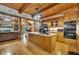 Open-concept kitchen with a large island, granite countertops, stainless steel appliances, and wood cabinetry at 800 Knox Ln, Canton, GA 30114