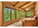 Wood-paneled sunroom featuring abundant natural light and comfortable seating at 800 Knox Ln, Canton, GA 30114
