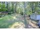 Expansive backyard with mature trees, shed, and plenty of room for outdoor activities at 145 Holly Nw Rd, Atlanta, GA 30314