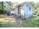 The exterior back of the home features a steel gate and partial grass covering at 145 Holly Nw Rd, Atlanta, GA 30314