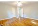 Cozy bedroom with hardwood floors, a ceiling fan, and neutral paint at 145 Holly Nw Rd, Atlanta, GA 30314