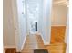 Hallway leading to a bathroom, featuring hardwood floors at 145 Holly Nw Rd, Atlanta, GA 30314