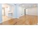 Open floor plan with hardwood floors that seamlessly connects living room and adjacent kitchen at 145 Holly Nw Rd, Atlanta, GA 30314