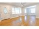Spacious living room with hardwood floors, ceiling fan, and plenty of natural light at 145 Holly Nw Rd, Atlanta, GA 30314