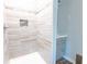Modern shower with stylish tile surround and a built-in niche for toiletries at 145 Holly Nw Rd, Atlanta, GA 30314