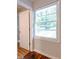 Window with blinds overlooking the backyard at 145 Holly Nw Rd, Atlanta, GA 30314