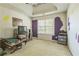 Bedroom with a window view, TV, and a small table set at 2130 Boulder Gate Dr, Ellenwood, GA 30294