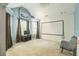 A bonus room area featuring curtains, a movie screen and an armchair at 2130 Boulder Gate Dr, Ellenwood, GA 30294