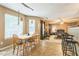 Dining area features tile flooring, a wooden table, and natural light at 2130 Boulder Gate Dr, Ellenwood, GA 30294