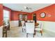 Elegant dining room featuring a round table, soft lighting, and warm-toned walls for inviting meals at 2130 Boulder Gate Dr, Ellenwood, GA 30294