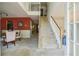 Inviting foyer with staircase, transitioning to a dining area showcasing a harmonious blend of colors at 2130 Boulder Gate Dr, Ellenwood, GA 30294