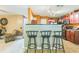 Kitchen with bar seating looking to living area at 2130 Boulder Gate Dr, Ellenwood, GA 30294