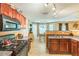 Kitchen with a range, oven, microwave and adjacent dining area with plenty of light at 2130 Boulder Gate Dr, Ellenwood, GA 30294