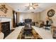 Comfortable living room with fireplace, patterned rug, and neutral walls at 2130 Boulder Gate Dr, Ellenwood, GA 30294