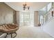 Bright living room featuring large windows, neutral walls, and plush carpet, creating a cozy atmosphere at 2130 Boulder Gate Dr, Ellenwood, GA 30294
