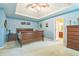 Main bedroom features carpet and tray ceiling at 2130 Boulder Gate Dr, Ellenwood, GA 30294