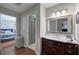 Bathroom featuring a wooden vanity with marble countertop, adjacent to bedroom at 505 Bainbridge Dr, Atlanta, GA 30327