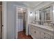 Elegant bathroom featuring double closets, a marble vanity, and classic tiling in a well-lit space at 505 Bainbridge Dr, Atlanta, GA 30327