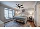 Inviting bedroom featuring a large window bench seat, a ceiling fan, and cozy decor at 505 Bainbridge Dr, Atlanta, GA 30327
