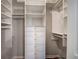 Well-organized walk-in closet featuring custom shelving and drawers for ample storage at 505 Bainbridge Dr, Atlanta, GA 30327