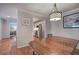 Dining room featuring an overhanging light fixture, hardwood floors, and view to kitchen and bedroom at 505 Bainbridge Dr, Atlanta, GA 30327