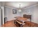 Bright dining room with a large table, a bench, and hardwood floors, perfect for Gathering gatherings at 505 Bainbridge Dr, Atlanta, GA 30327
