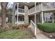 Townhouse exterior shows dual decks with landscaping and walkway at 505 Bainbridge Dr, Atlanta, GA 30327