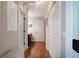 Hallway with hardwood floors and white doors offers a clean and modern feel at 505 Bainbridge Dr, Atlanta, GA 30327