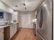 Bright kitchen features marble countertops, hardwood floors, a view to the living room, and stainless steel appliances at 505 Bainbridge Dr, Atlanta, GA 30327