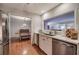 Kitchen featuring view to dining room and living room, marble countertops, and stainless steel appliances at 505 Bainbridge Dr, Atlanta, GA 30327
