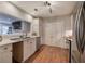 Bright kitchen features marble countertops, hardwood floors, a view to the living room, and stainless steel appliances at 505 Bainbridge Dr, Atlanta, GA 30327